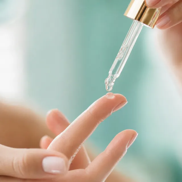 Serum drop on a fingertip
